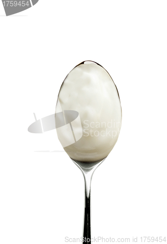 Image of Spoon of yogurt isolated on white