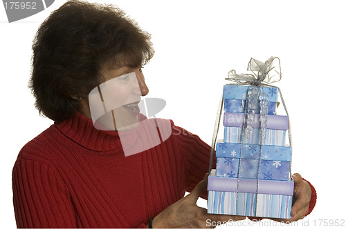 Image of happy woman with gifts stack