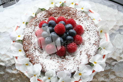 Image of Chocolate gateau with berries