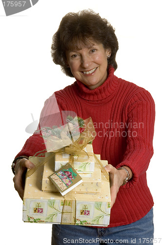 Image of happy woman with gifts stack