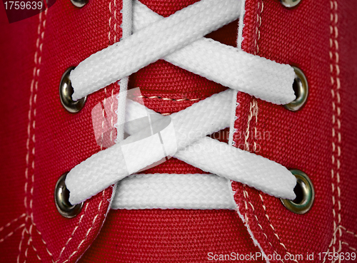 Image of White lace on red sneakers