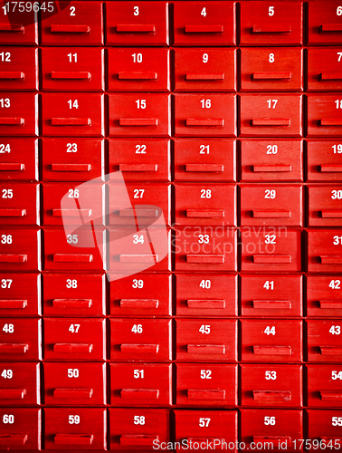 Image of Numbered red wooden cases