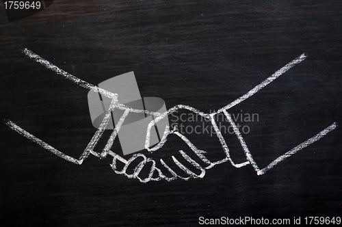 Image of Chalk drawing of handshaking on a blackboard