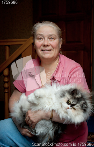 Image of The elderly lady with a cat