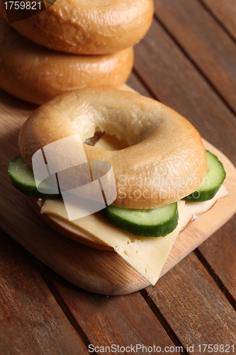 Image of fresh cheese and ham bagel 