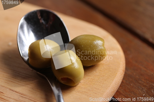 Image of filled olives on a spoon