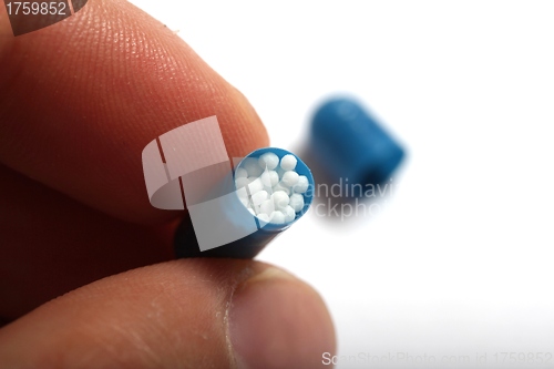 Image of open homeopathic capsule