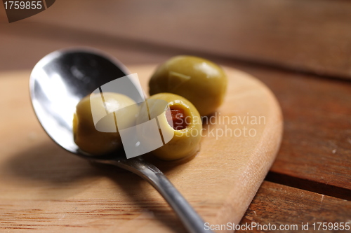 Image of filled olives on a spoon