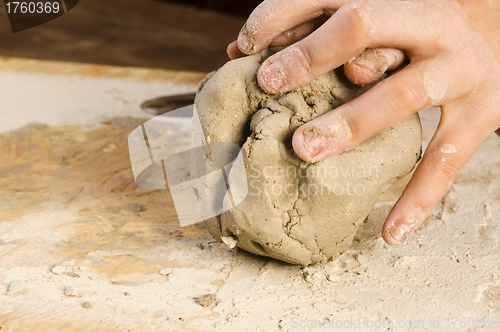 Image of Child hands of a potter