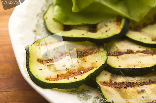 Image of Grilled organic zucchini slices with herbs and spices