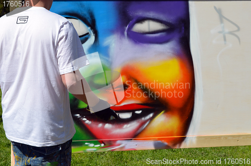 Image of graffiti draw. Man with flask draw colorful face 