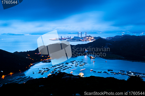 Image of Power station at night with mountain landscape