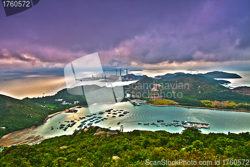 Image of Mountain sunset in island with power plant