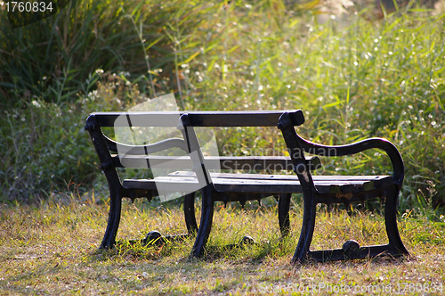 Image of Chairs in countryside under sunshine