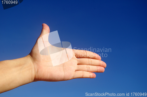 Image of Give hand under blue sky