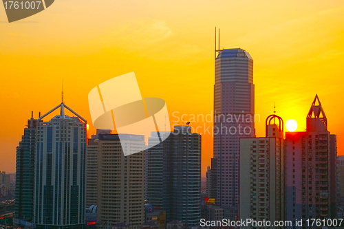 Image of Shanghai sunset with skyscrapers background
