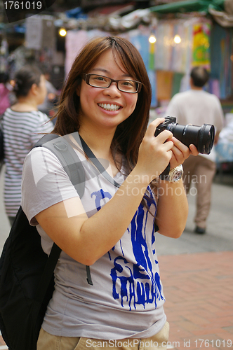 Image of Asian woman photographer