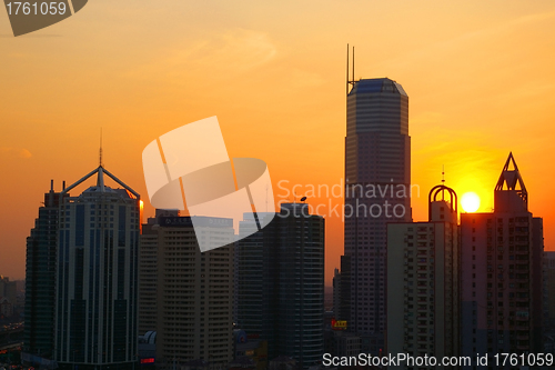 Image of Shanghai sunset with skyscrapers background