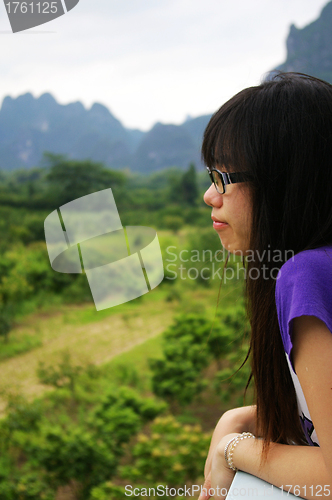 Image of Asian woman thinking outdoor