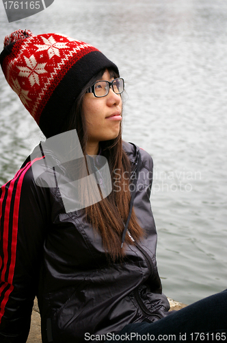 Image of Asian woman thinking