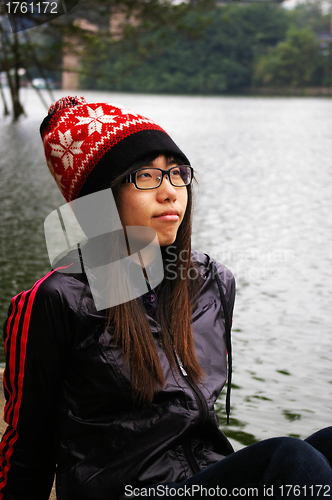 Image of Asian woman thinking