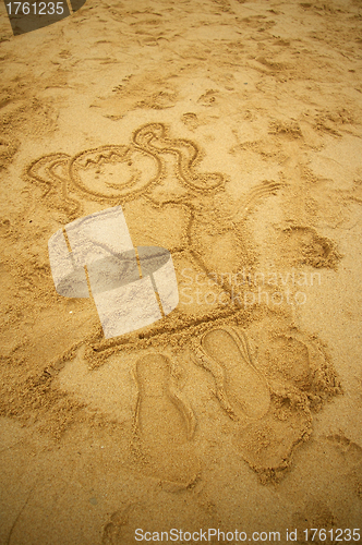 Image of Girl drawing on beach