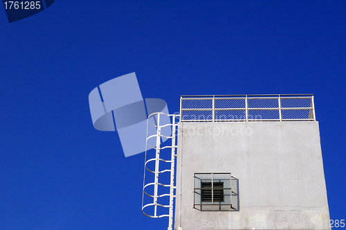 Image of White building under blue sky