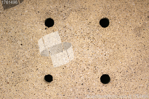 Image of Four holes on the ground background