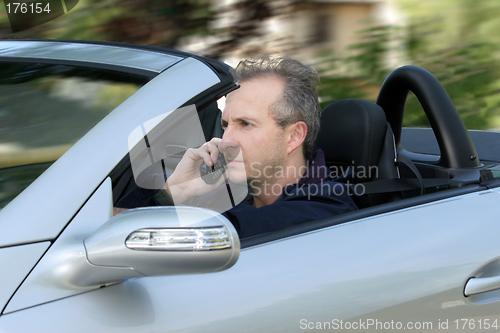 Image of Man driving a car