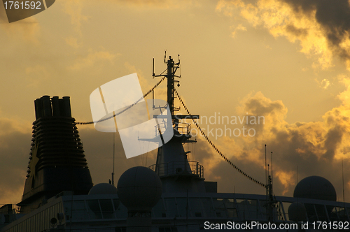 Image of Tackles sailing ship on the background of the sunset sky