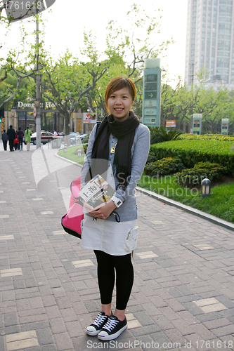 Image of Asian woman travelling in Shanghai, China.