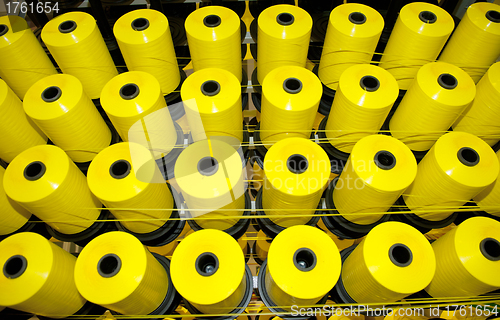 Image of Coils of yellow threads