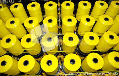 Image of Coils of yellow threads