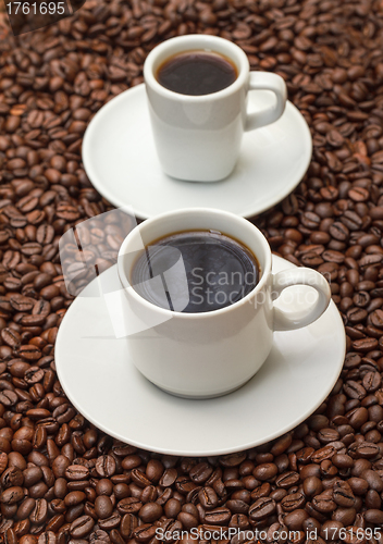 Image of Cups with Hot Coffee on Coffee Beans 