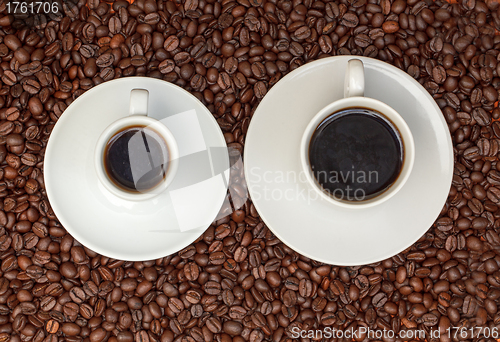 Image of Cups with Hot Coffee on Coffee Beans