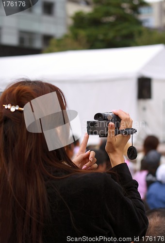 Image of Woman recording an event