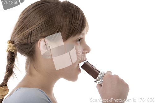 Image of Girl eating chocolate bar