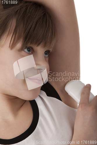 Image of Girl applying deodorant on armpit