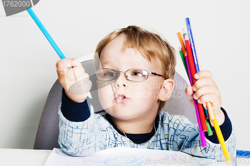 Image of Portrait of the little boy with pencils