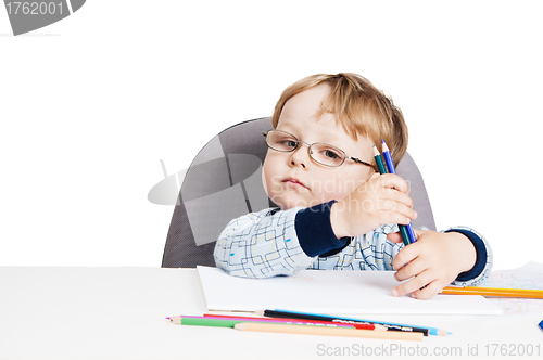 Image of Portrait of the little boy with pencils