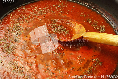 Image of making pizza sauce