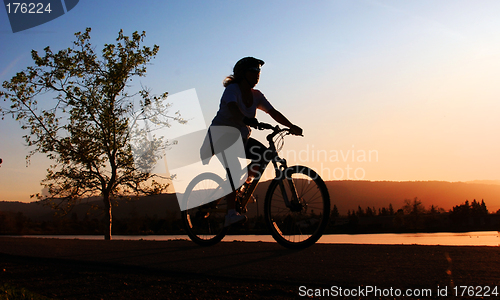 Image of Woman riding her bike