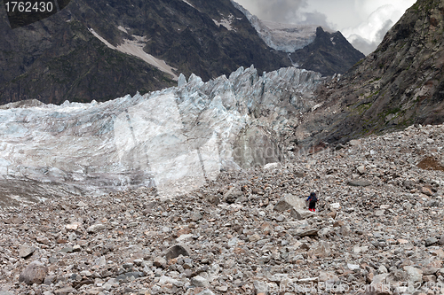 Image of Hiker on glacier moraine