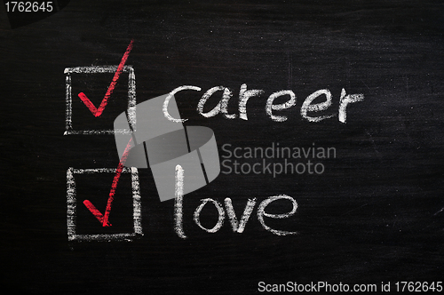 Image of Love and career choices with check boxes on a blackboard