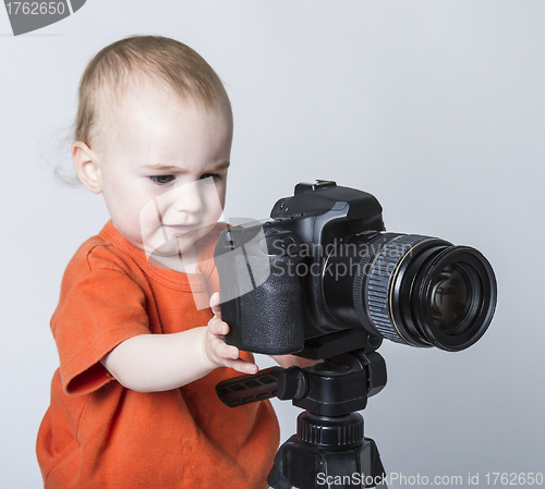 Image of young child with digital camera