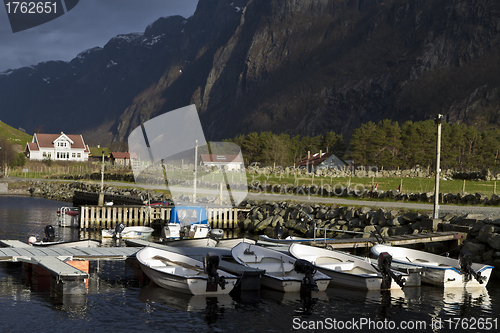 Image of small harbor with mountains in background