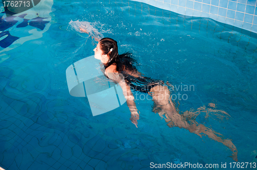 Image of Attractive girl in swimming pool