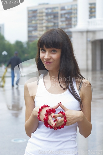 Image of Girl with red beads