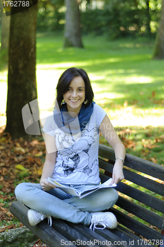 Image of College student on a bench