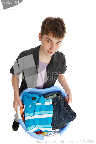 Image of Boy holding a basket of clothes